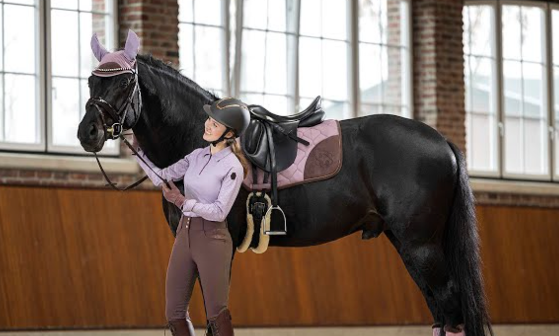 An assortment of chic equestrian shirts intended for style-conscious riders. The collection includes various designs such as checkered, plaid, and solid color shirts. Each design is tailored to provid